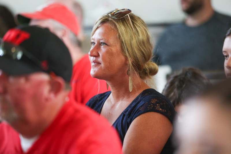 a woman with sunglasses on her head