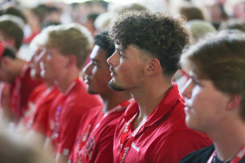 a group of people in red shirts