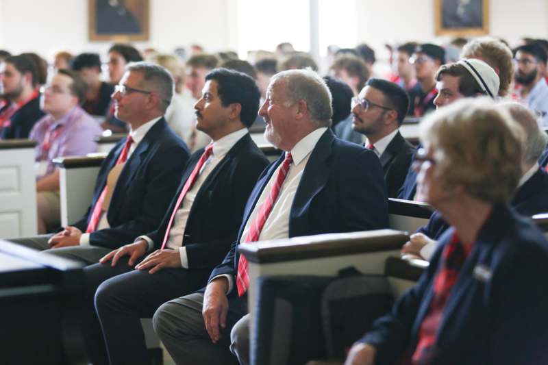 a group of people sitting in a room