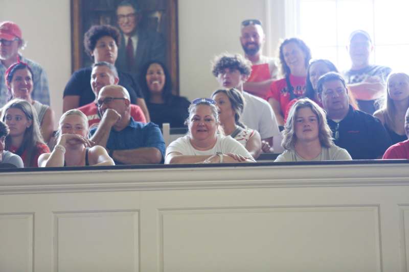 a group of people sitting in a room