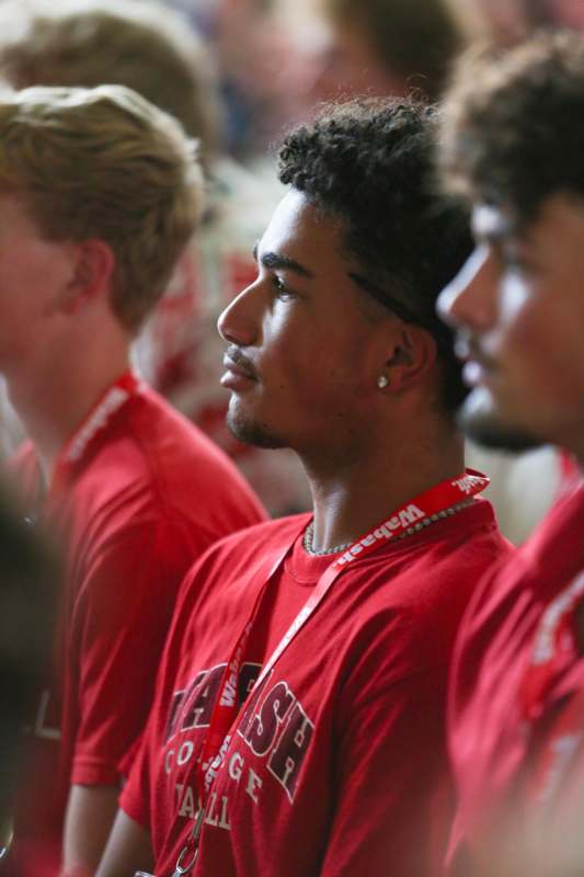 a group of men in red shirts