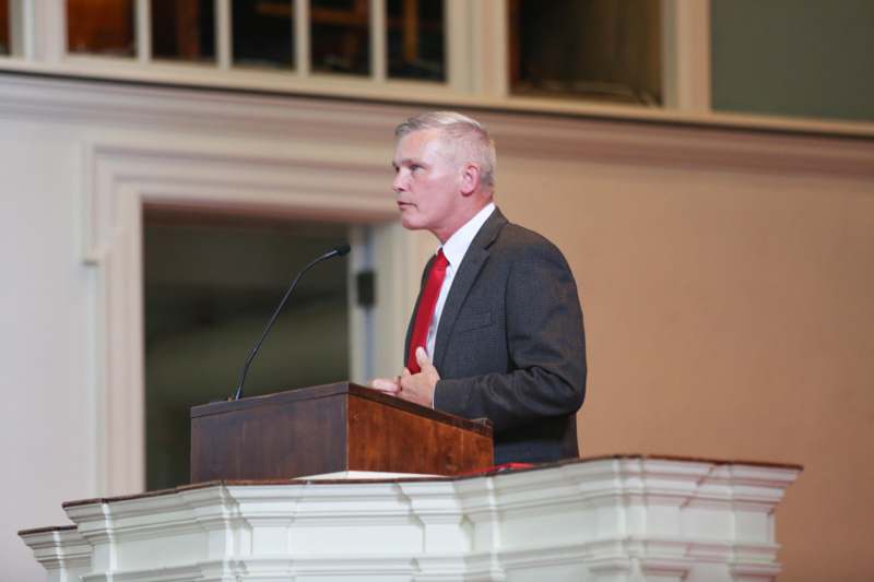 a man standing at a podium