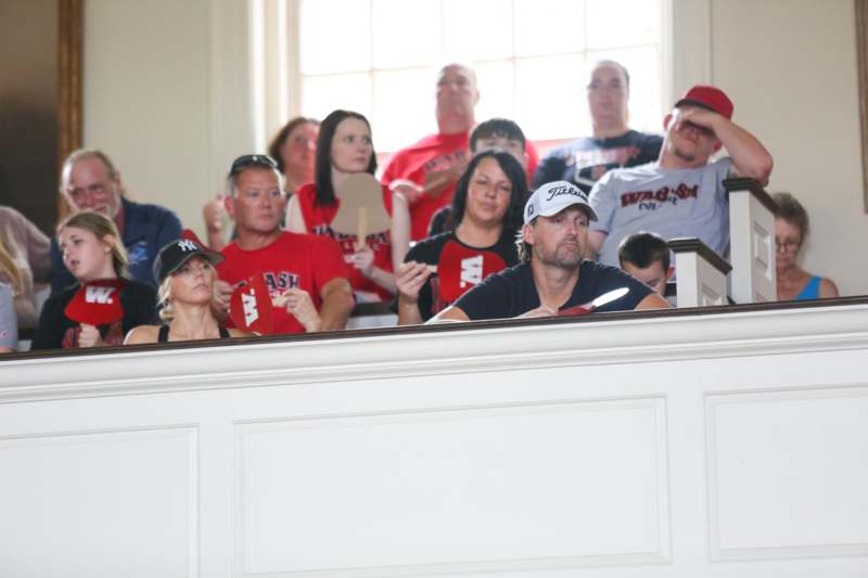 a group of people sitting in a room