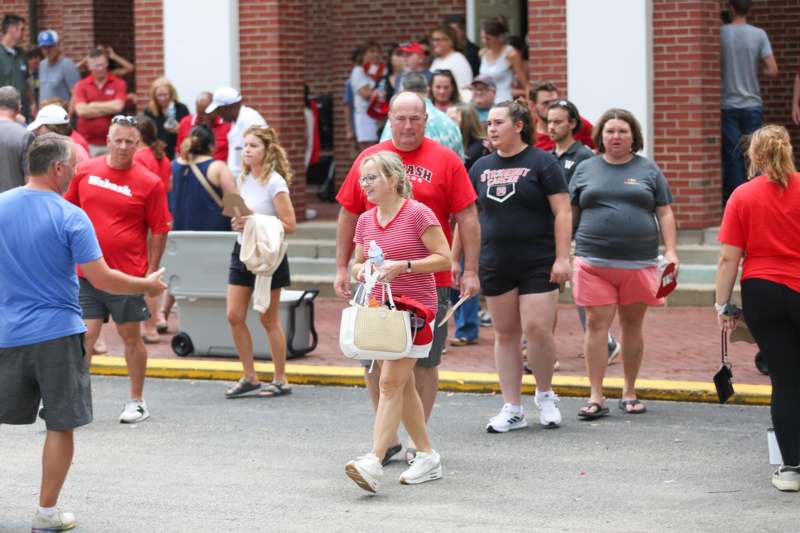 a group of people walking on a street