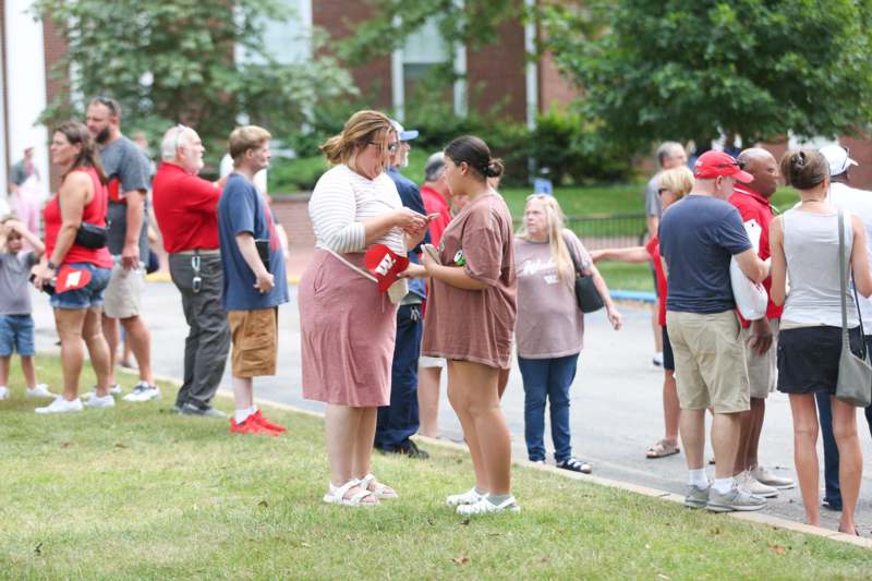 a group of people standing in a line