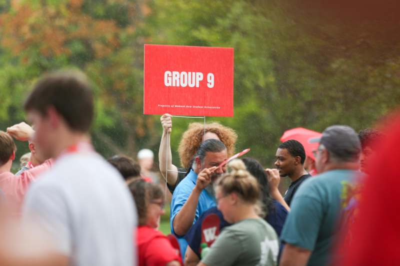 a group of people holding a sign