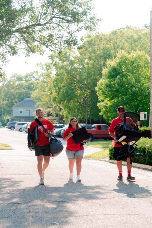 a group of people walking down a street