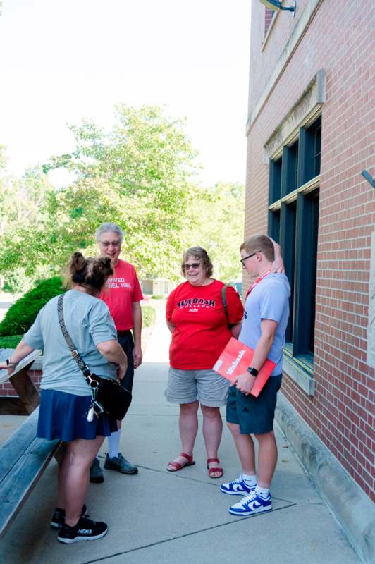 a group of people standing outside a building