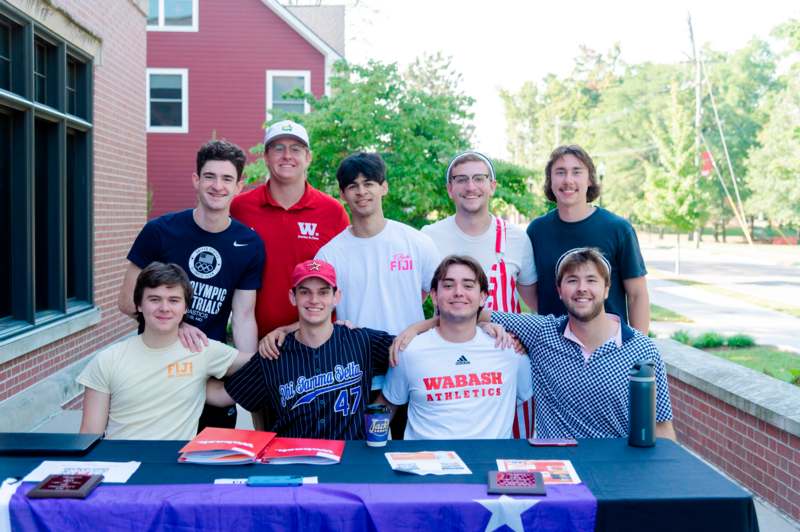 a group of men posing for a photo