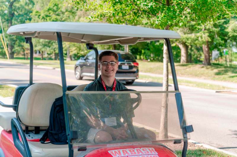 a man in a golf cart