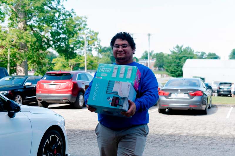 a man carrying a box