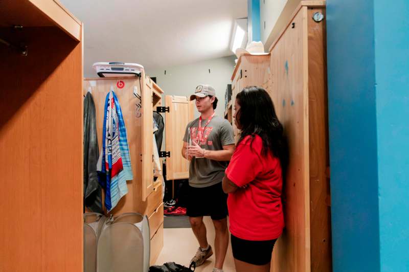 a man and woman in a locker room