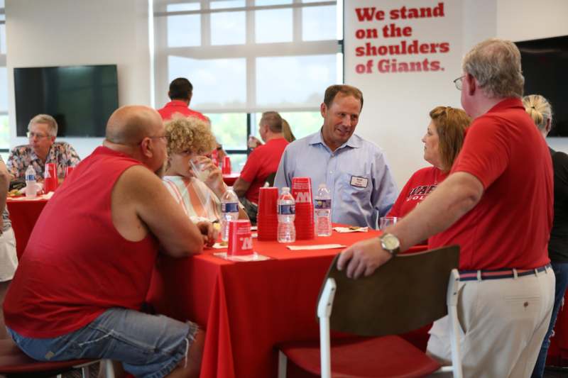 a group of people sitting at a table