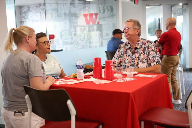 a group of people sitting at a table