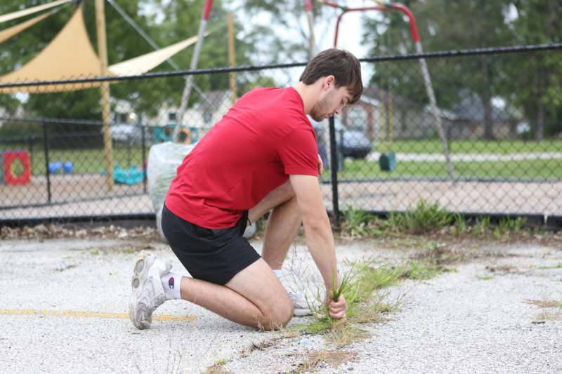 a man kneeling on the ground