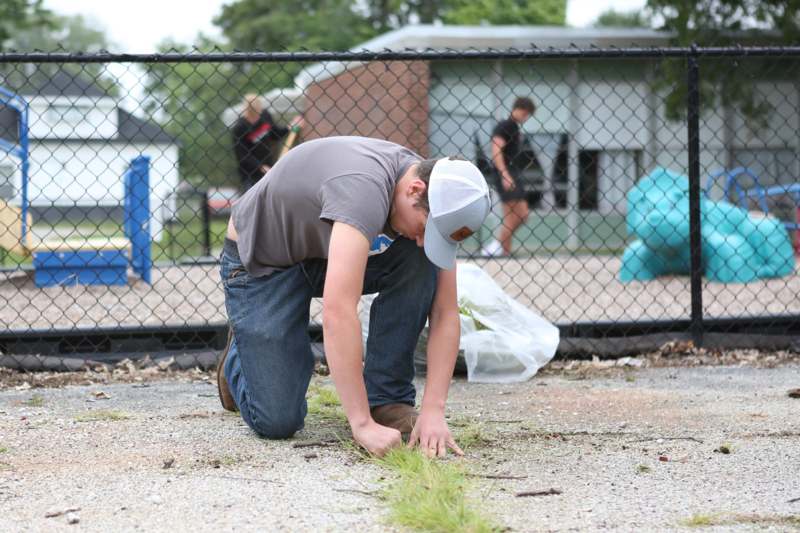 a man kneeling on the ground