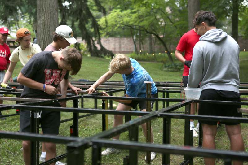 a group of people building a structure