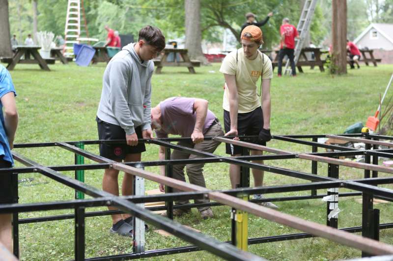 a group of people building a structure