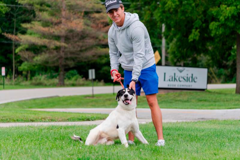 a man holding a dog