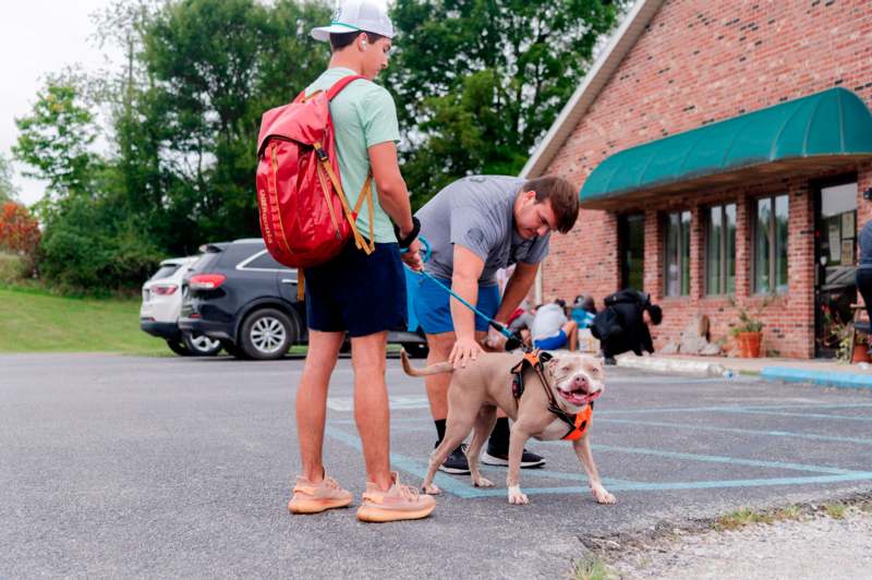 a man holding a dog