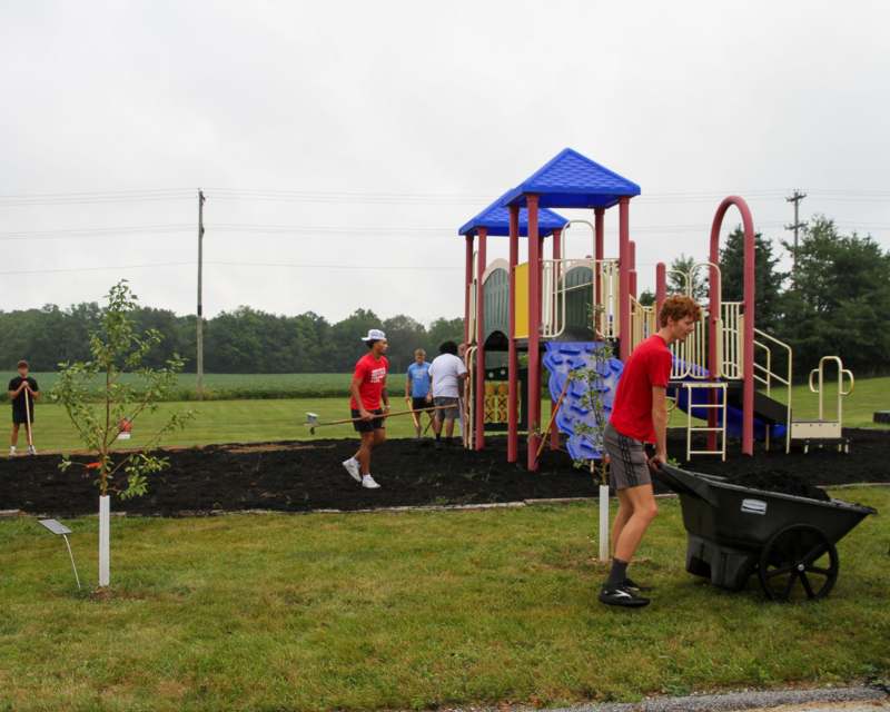 a group of people at a playground