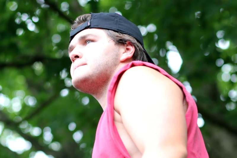 a man in a hat looking up