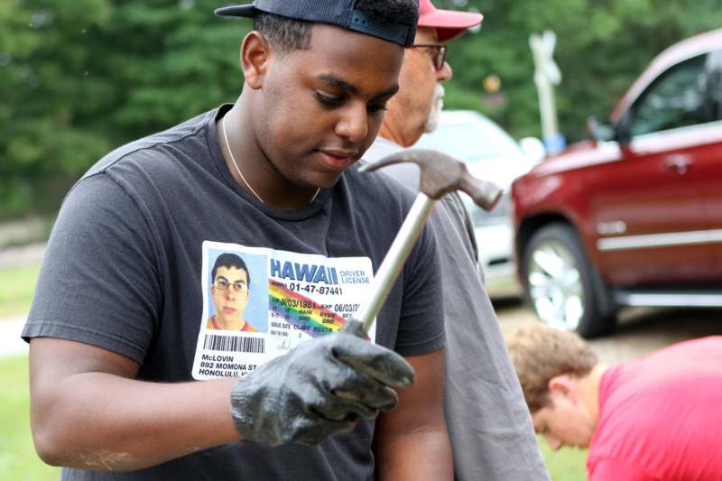 a man holding a hammer