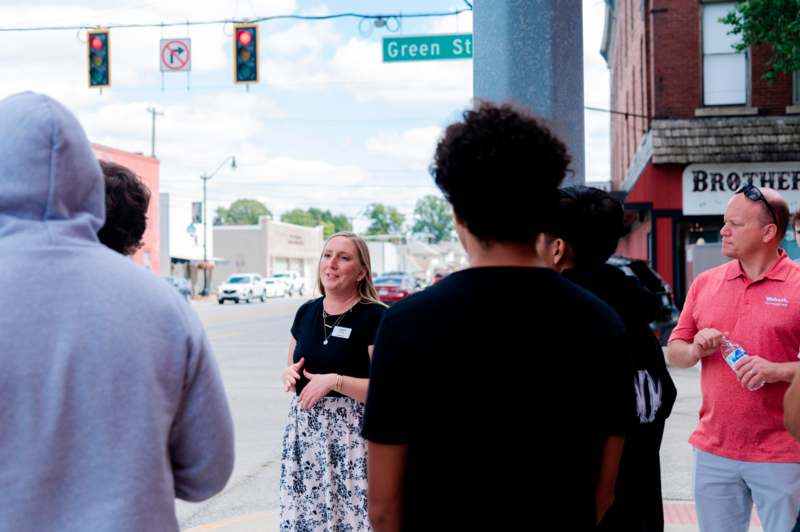 a woman standing on a sidewalk