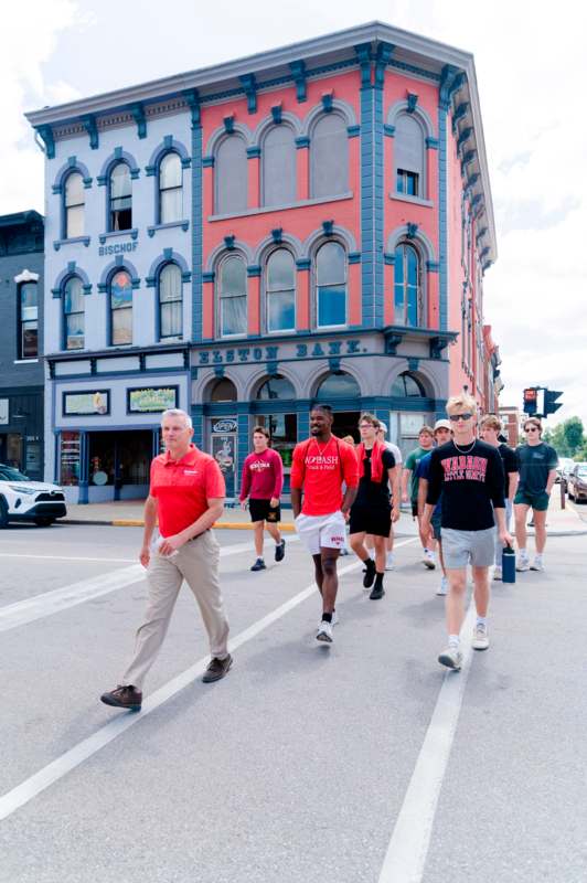 a group of people walking on a street