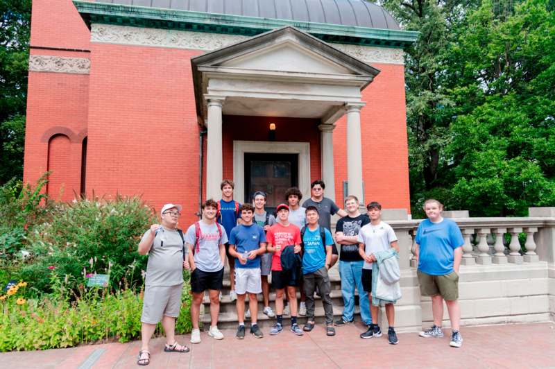 a group of people standing in front of a building