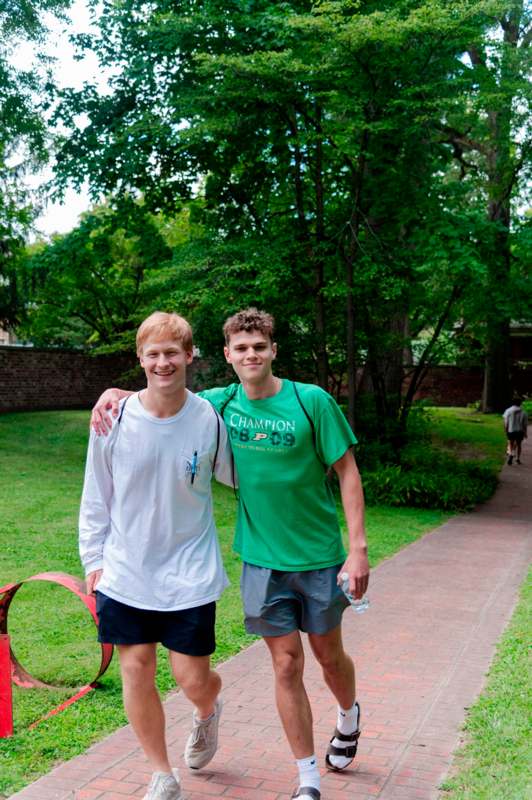 two men standing on a path