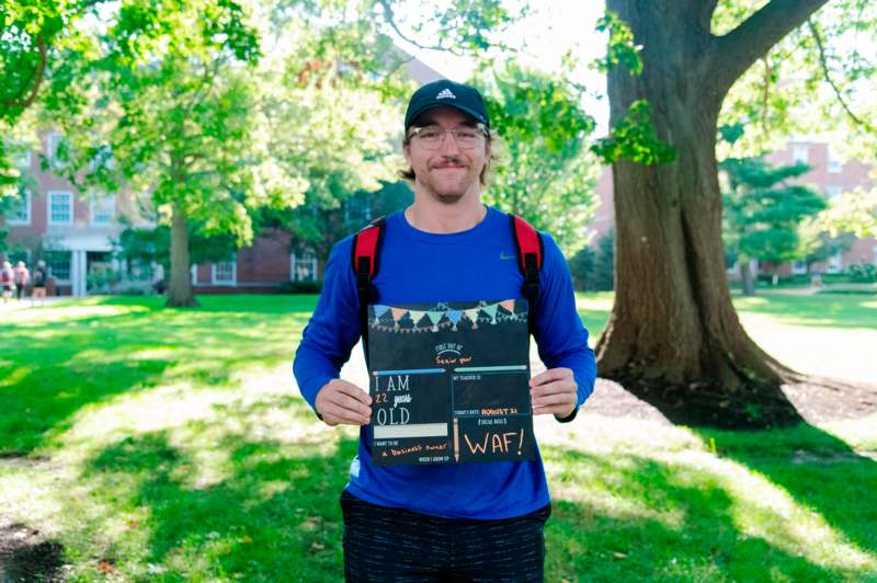 a man holding a sign