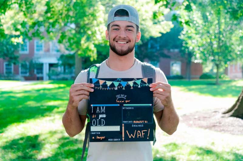 a man holding a sign