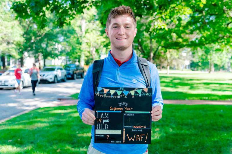 a man holding a sign