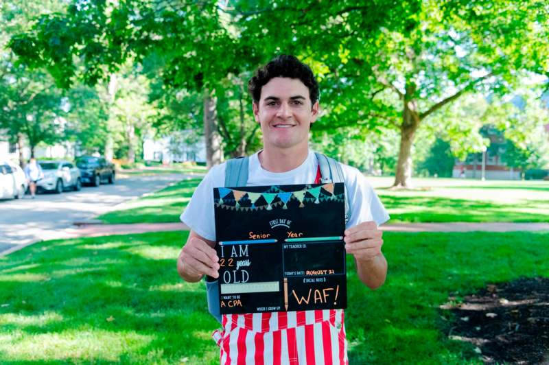 a man holding a sign