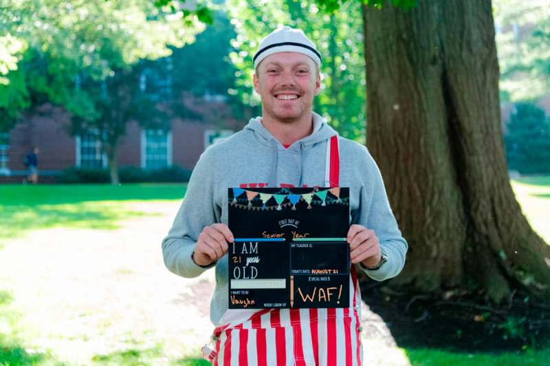 a man holding a sign