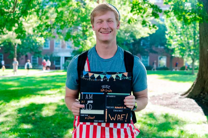 a man holding a sign