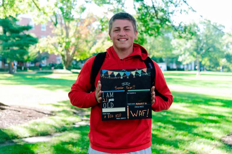 a man holding a sign