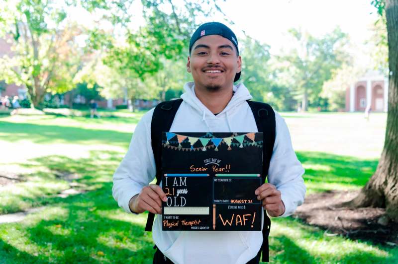 a man holding a sign