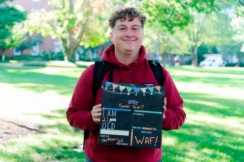 a man holding a sign