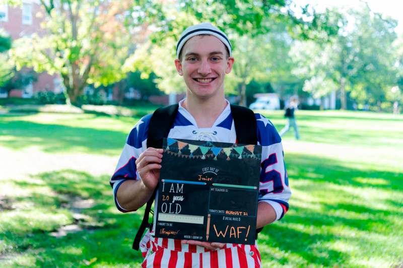 a man holding a sign