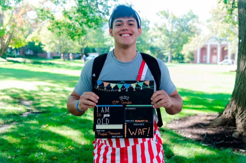 a man holding a sign