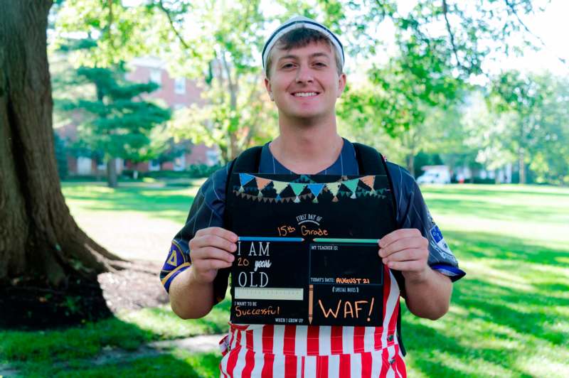 a man holding a sign