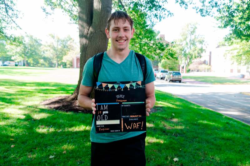 a man holding a sign