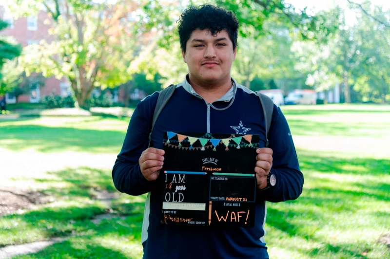 a man holding a sign