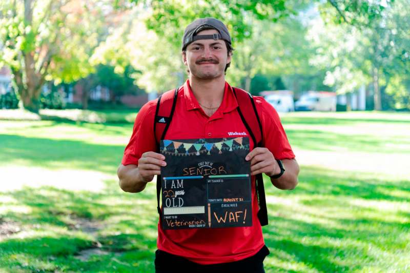 a man holding a sign