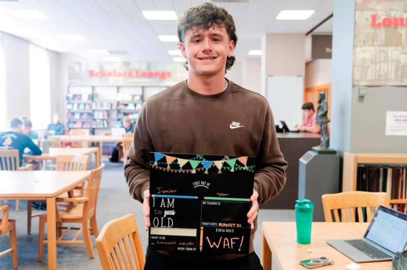 a man holding a sign