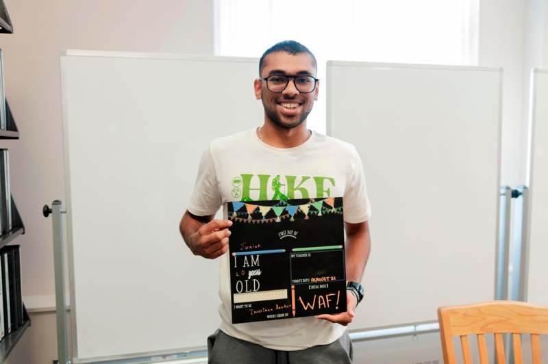 a man holding a sign