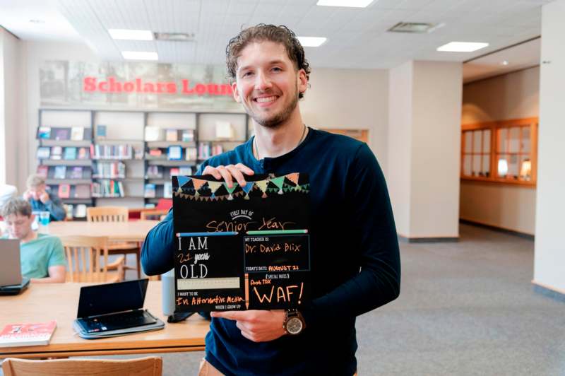 a man holding a sign