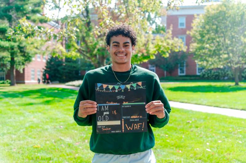 a man holding a sign